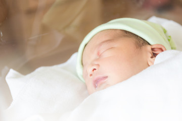 Selective focus of newborn baby boy sleeping
