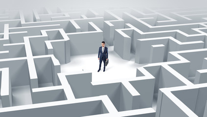 Young businessman standing in a middle of a 3D maze
