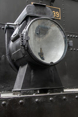 Old lamp on the steam locomotive.  Retro light in front part of train.