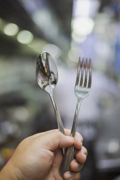 Spoon and frok on hand