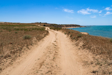 Dirt road along the sea coast