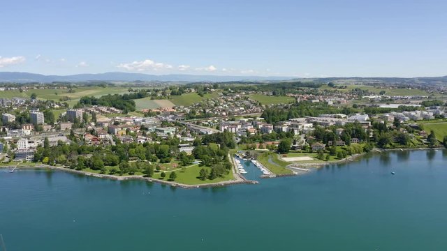 Aerial above Lake Leman, looking towards Preverenges town, Vaud, Switzerland