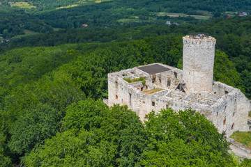 Fototapeta na wymiar Aerial view of Lipowiec castle.. Historic castle Lipowiec and antique building museum. The ruins of the top of the mountain. Summer time.