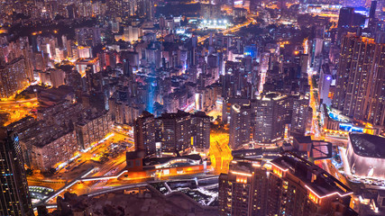 Fototapeta na wymiar High view of Hong Kong skyline cityscape night light with traffic light in the road, expressway and intersection with skyscrapers at downtown
