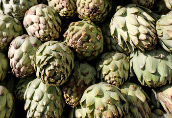 background of green artichokes at market