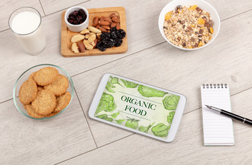 Fresh food on the table with a tablet PC.