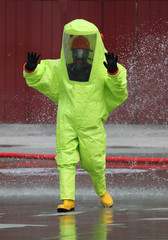 fireman wears a special suit to extinguish a fire caused by chem