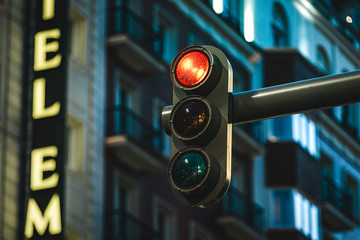 Modern Traffic light showing red color at night in a modern city