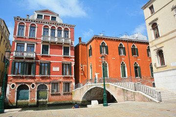 Beautiful view on old buildings, cozy bridge and street canal in Venice.