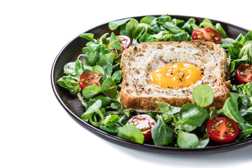 Breakfast - toasted bread with fried egg and vegetables