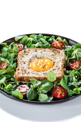 Breakfast - toasted bread with fried egg and vegetables