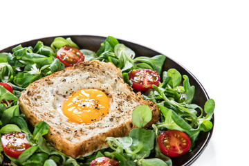 Breakfast - toasted bread with fried egg and vegetables