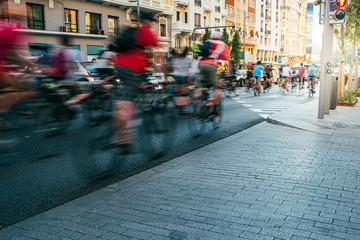 blurred group of cyclist riding on Madrid City Center