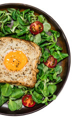 Breakfast - toasted bread with fried egg and vegetables