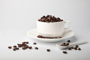 aromatic roasted coffee beans on white background