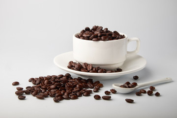 aromatic roasted coffee beans on white background