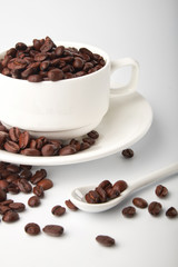 aromatic roasted coffee beans on white background