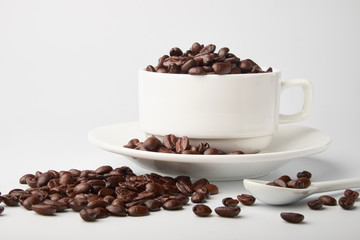 aromatic roasted coffee beans on white background