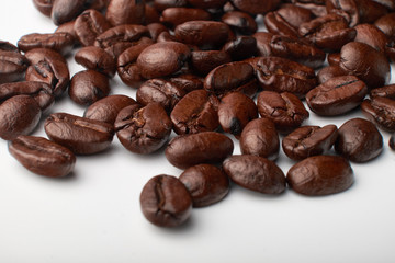 aromatic roasted coffee beans on white background