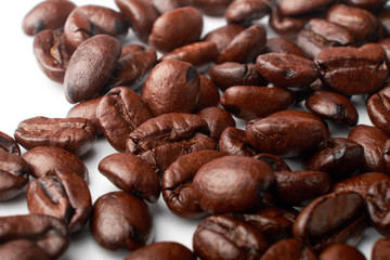 aromatic roasted coffee beans on white background