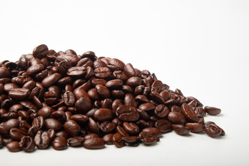 aromatic roasted coffee beans on white background