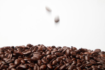 aromatic roasted coffee beans on white background