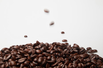 aromatic roasted coffee beans on white background