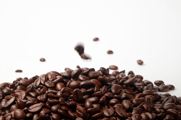 aromatic roasted coffee beans on white background