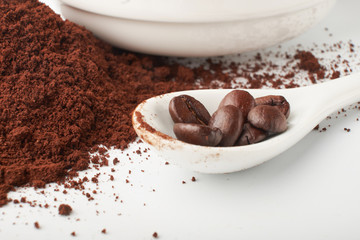 aromatic roasted coffee beans on white background