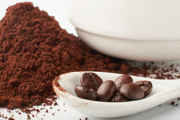 aromatic roasted coffee beans on white background