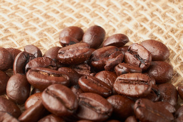 aromatic roasted coffee beans on white background
