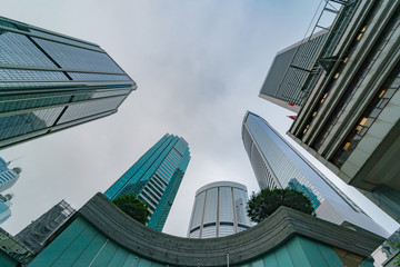 Low angle view of office skyscraper buildings in business district city.