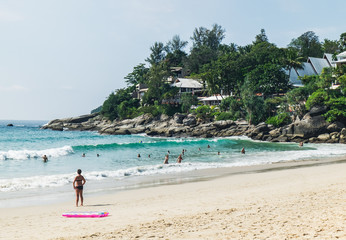 Tourists have a rest, walk and swim at Kata Noi beach - one of the best beaches in Phuket, Thailand