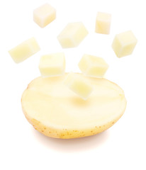 Funny potato cut in half with explosion of dice (cubes). Isolated on white background