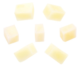 Potatoes cut into cubes (dices). Isolated on white background