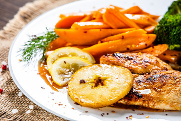 Grilled cgicken breast, French fries and vegetable salad