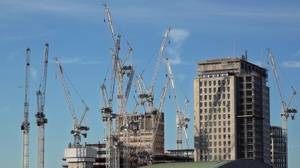 Fototapeta premium Construction site with new buildings and cranes
