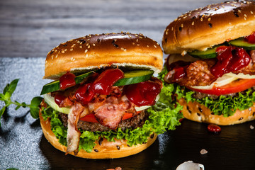 Tasty burgers served black stone plate