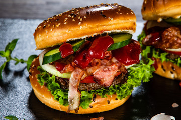 Tasty burgers served black stone plate