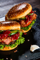 Tasty burgers served black stone plate
