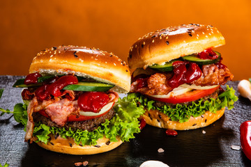Tasty burgers served black stone plate