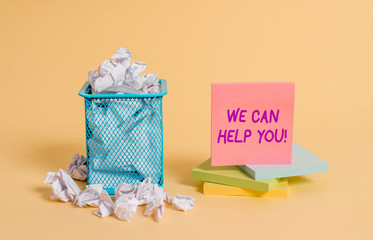 Conceptual hand writing showing We Can Help You. Concept meaning offering good assistance to customers or friends crumpled paper and stationary paper placed in the trash can