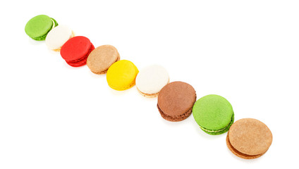 Macaroons on a white background. A row of colored macaroons. Diagonal composition.