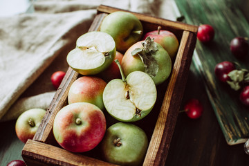Homemade ripe garden apples in a wooden box