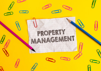Conceptual hand writing showing Property Management. Concept meaning Overseeing of Real Estate Preserved value of Facility Blank crushed paper sheet message pencils colored background