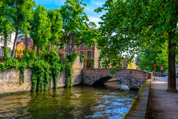 Fototapeta na wymiar View of the historic city center of Bruges (Brugge), West Flanders province, Belgium. Cityscape of Bruges with canal.