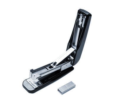 Opened black stapler isolated on white and paper clips for it