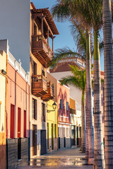Colourful houses on street Puerto de la Cruz town, Tenerife, Canary Islands, Spain. Tourist pedestrian street near ocean with traditional houses
