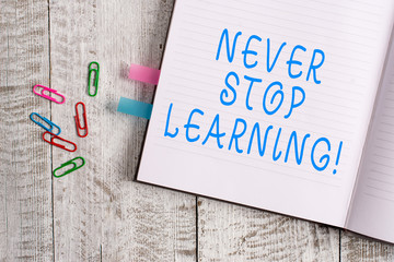 Text sign showing Never Stop Learning. Business photo text keep on studying gaining new knowledge or materials Thick pages notebook stationary placed above classic look wooden backdrop