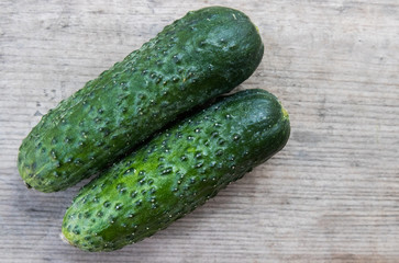 cucumbers on wooden background